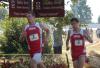 Zach Covington (left) and Joel Wellum race past Union street signs as fans watch along the way. - Photo by Steven Aldridge
