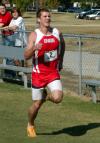 Zach Covington sprints over the final meters during the Union University Cross Country Invitational. - Photo by Steven Aldridge