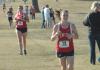 Hannah Staggs (13) races during the Union University Cross Country Invitational.  Teammate Jessi Shubert follows close behind.  Union took first place in the event. - Photo by Tommy Sadler
