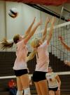Anna Sims (left) and Katie Adams go up for the block in Union's 3-0 win over Rhodes College. - Photo by Morris Abernathy