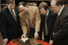 Ray Van Neste, George Guthrie, Carl Trueman & Brian Denker examine the 1615 Geneva Bible that was recently acquired by the R. C. Ryan Center for Biblical Studies.  Carl Trueman, associate professor of church history and historical theology at Westminster Theological Seminary, was on campus recently to speak on the history of the Geneva Bible. - Photo by Jim Veneman