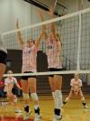Anna Sims (left) and Amanda Hutchison Coyle (right) go up for the block during Dig Pink Night versus Rhodes (Tenn.) College. - Photo by Morris Abernathy