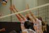 Lady Bulldogs Ashley Young (left) and Amanda Coyle (right) block a hit by Rhodes (Tenn.) College. - Photo by Morris Abernathy