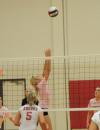 Katie Adams sets the ball for a teammate during a match versus Rhodes (Tenn.) College. - Photo by Morris Abernathy