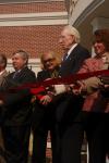 Carl Grant cuts the ribbon at the dedication of the Carl Grant Events Center. - Photo by Angela Abbamonte