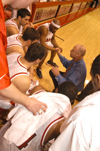 Coach Ralph Turner gives instructions during a timeout at the Homecoming game against Hannabal-LaGrange. - Photo by Lindsay Stavish