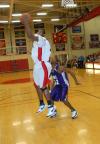 Brian Lake, junior forward, takes a shot around a defender in a game versus Bethel (Tenn.) College. - Photo by Morris Abernathy