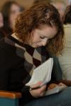Sophomore social work major Michelle Marks takes note during Russ Pflasterer's sermon on Christ-centered economics. Pflasterer, a 1995 graduate of Union, currently serves as pastor of City Fellowship Baptist Church in Jackson, Tenn. - Photo by Beth Spain
