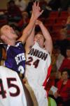 Junior Matt Neaville shoots over the hand of a Bethel (Tenn.) College defender. - Photo by Morris Abernathy
