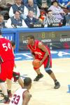 Sophomore forward Brian Lake (21) prepares to pass the ball to a teammate in a game versus Southern Nazarene (Okla.) University during the Sweet Sixteen round of the 2007 NAIA National Tournament. - Photo by Uncredited
