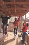Sarah Orr (center) and India Hickman (right) assist with the efforts of Battle Creek's Habitat for Humanity. - Photo by Justin Veneman