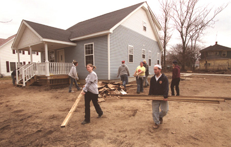 The GO Battle Creek team cleans up a Habitat for Humanity work site.