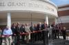 Individuals instrumental in the construction of the Grant Events Center prepare for the ribbon cutting. - Photo by Morris Abernathy