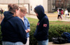 Union's Meredith Erlandson (left), Heather Moellman (center) and Stacy Storey pray for the students of Eastern Illinois University. - Photo by Justin Veneman