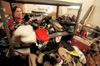 Andrea Hudgins sorts shoes at the Salvation Army's Purdue Center of Hope during GO Memphis. - Photo by Justin Veneman