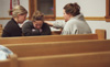 Union students Heather Moellman (left) and Meredith Erlandson (right) pray with an Eastern Illinois University student (center) during GO Illinois. - Photo by Justin Veneman