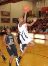 Christina Ray goes up for the layup after driving past her defenders. - Photo by Morris Abernathy