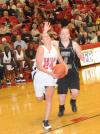 Laura Crittendon drives to the basket in Union's Homecoming win over St. Catharine (Ky.) College. - Photo by Morris Abernathy