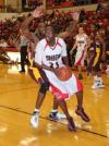 Junior guard/forward Greg Truvillion drives around a Robert Morris (Ill.) College defender to score in Union's Homecoming victory. - Photo by Morris Abernathy