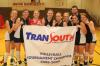 The Union Volleyball team surrounds their championship banner for a picture after winning the TranSouth Conference Tournament. - Photo by Morris Abernathy