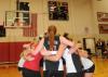 The Union volleyball team huddles after their game-winning point clinches the 2008 TranSouth Conference Tournament Title. - Photo by Morris Abernathy