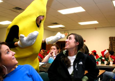 Michaela Witzke, sophomore art major, shows off her banana costume to Abby Priddy, junior art major, and Alanna Taylor, senior art major, at the annual art retreat.