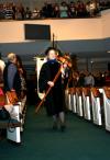 Jeannette Russ, faculty of the year and engineering professor, carries the mace during the fall commencement services.  - Photo by Kristi McMurry