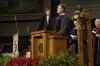 Chris Mathews, chair of the music department, leads in a hymn during the fall graduation ceremony. - Photo by Beth Spain