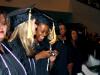 Queen McGhee and Lindsey Louviere, both receiving their bachelor of science in nursing, laugh over candid shots during the fall commencement services. - Photo by Kristi McMurry