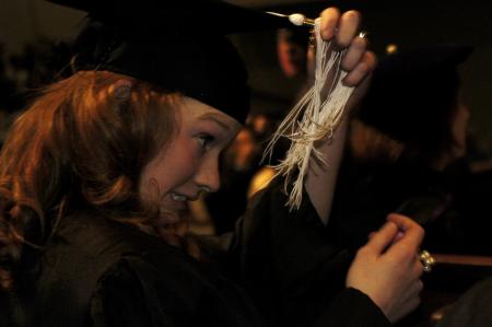 Lily Zopfi, art major, struggles to correct her tassel during the fall graduation ceremony. 