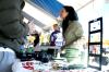 Alumni Amanda Bain, of Beech Bluff, Tennessee, sells her handmade jewelry and pottery at the annual Homecoming event, Arts in the Park. - Photo by Kristi McMurry