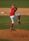 Senior pitcher Josh Holman prepares to throw to the plate. - Photo by Morris Abernathy