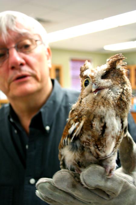Biology professor James Huggins gives a presentation on the rescued owl that the Biology department takes care of.  Art students were the attendees of the presentation.