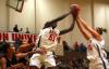 Teammates Josephine Owino and Merideth Richardson Jacobs both go up for a rebound during the third game of the Rotary Classic.  - Photo by Kristi McMurry