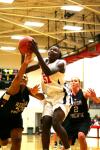 Josephine Owino grabs a rebound during the third game of the Rotary Classic.  - Photo by Kristi McMurry