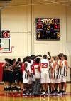 Azusa Pacific and Union teams huddle together after the third game of the Rotary Classic. Union won the game 97-61.  - Photo by Kristi McMurry