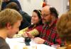 Lee Benson, art department chair, and Kelsey Nagy, sophomore art major, fellowship with other members of the art department and the annual Thanksgiving dinner. - Photo by Kristi McMurry