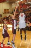Senior center Josephine Owino shoots over defenders in Union's 79-50 win over Freed-Hardeman (Tenn.) University. - Photo by Morris Abernathy