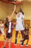Josephine Owino shoots over a Freed-Hardeman (Tenn.) defender in the Lady Bulldog's 79-50 win. - Photo by Morris Abernathy