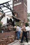 Jonathan Blair, a sophomore from Clinton, MS, helps salvage bricks from St. Luke's Episcopal Church in downtown Jackson.  The church was one of several buildings in the downtown area which were almost completely destroyed. - Photo by Jim Veneman