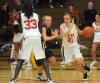 Junior guard Lindsay Flynn (21) drives around a defender in Union's win over Blue Mountain (Miss.) College. - Photo by Morris Abernathy