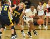 Freshman guard Lavanda Ross drives around defenders in Union's win over Blue Mountain (Miss.) College. - Photo by Morris Abernathy