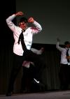 The men of Alpha Tau Omega used a Men in Black theme for their variety show act, which included many interesting dance moves. - Photo by Kristi McMurry