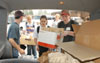 Senior Christina Jones (right) and other Union students load sack lunches and bottled water for distribution in Jackson's hardest hit areas. - Photo by Jim Veneman
