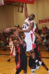 Brian Lake (21), senior forward, shoots over a defender in Union's win over Martin Methodist (Tenn.) College in the conference tournament. - Photo by Morris Abernathy