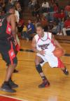 Keith Tolliver (35) drives around a defender to the basket. - Photo by Morris Abernathy