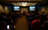 Students and guests at the MMM conference watch a short video about the disaster on February 5th and the rebuilding that has occurred since then. - Photo by Kristi McMurry