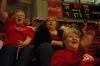Union fan Dot Cupples shakes her pom-poms with excitement as her friends Pam Coughlin (top right) and Sherrell Dorris cheer during the second half of the Lady Bulldog's first game of the NAIA National Tournament on Wednesday.  - Photo by Beth Spain