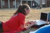 Sophomore biology major Carrie Moore studies in the courtyard outside the new complexes. - Photo by Beth Spain