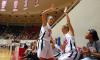 Kaitlin Dudley and Kayla Hudson high-five after their teammate, Sarah Chan, makes a basket during the semifinals of the 2009 NAIA tournament. - Photo by Kristi McMurry
